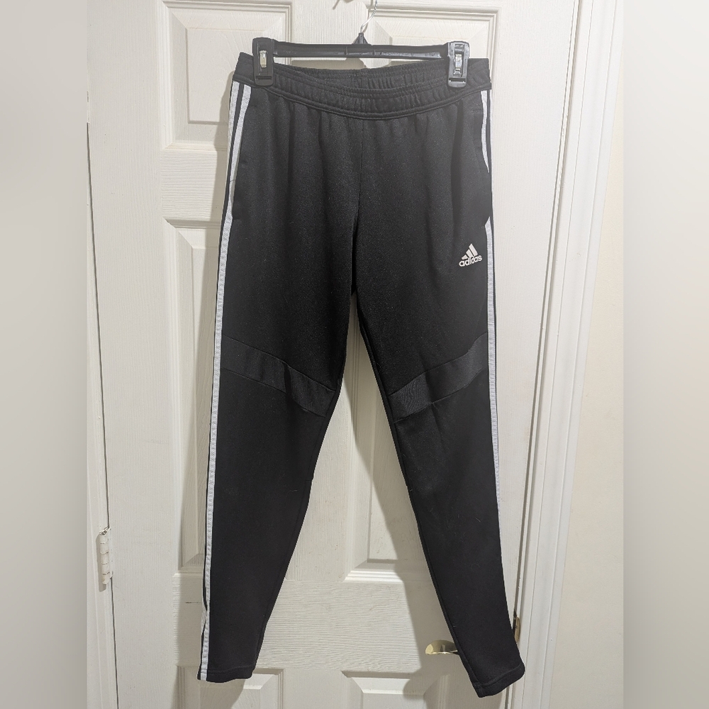 Womans Black Track Pants with White Side Stripes, Two Front Zippered Pockets.